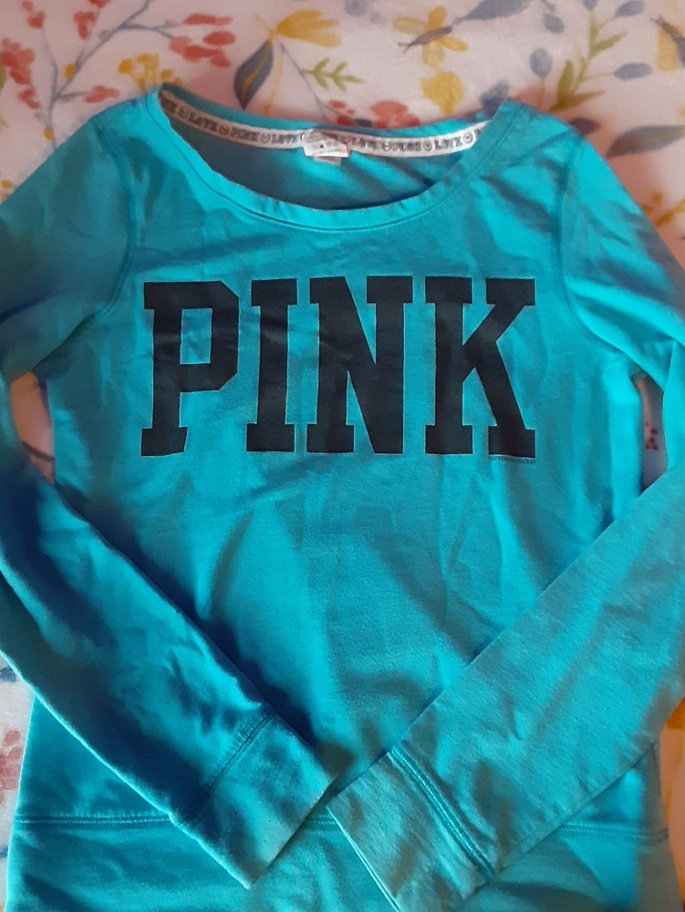 A Pink sweatshirt. Color's Blue & Black. size XS